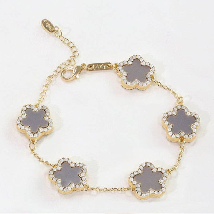 PEACH ACCESSORIES - EUR170 Five diamante edge petals bracelet: Black